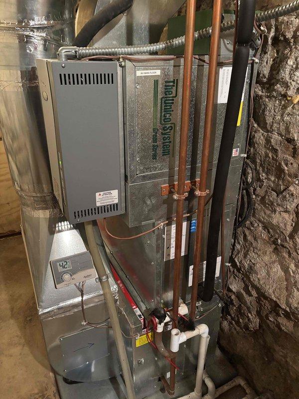 Completed comprehensive air conditioning maintenance on two condenser systems as part of annual family rewards agreement. Performed full inspection of both units including air filters, thermostats, temperature differential measurements, condensers, evaporator coils, blower motors, capacitors, compressors, refrigerant charge levels (410A and 454B), and condensate drain lines. All components inspected and tested with ambient temperature at 70 degrees; both systems operating within normal parameters with no deficiencies noted at time of service.