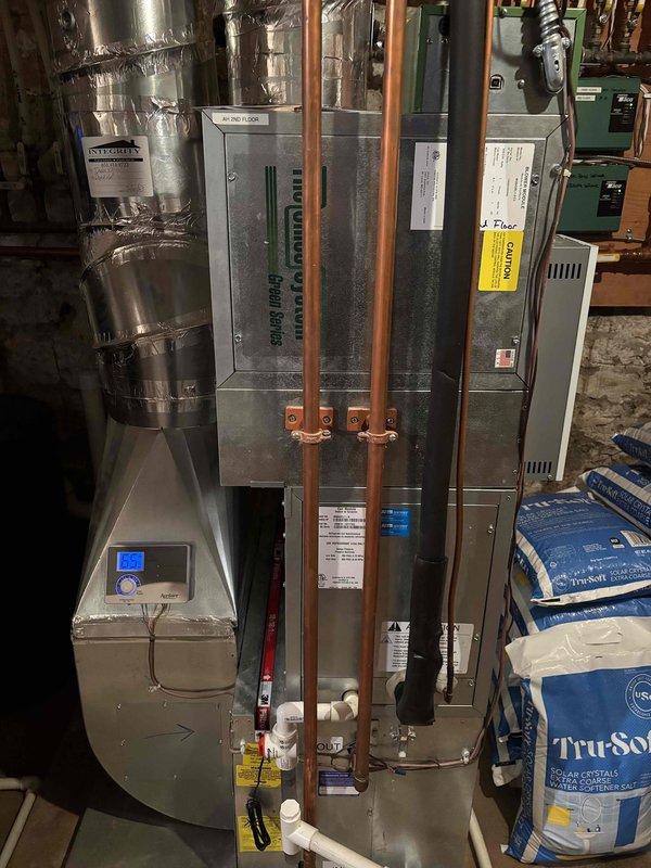 Completed comprehensive air conditioning maintenance on two condenser systems as part of annual family rewards agreement. Performed full inspection of both units including air filters, thermostats, temperature differential measurements, condensers, evaporator coils, blower motors, capacitors, compressors, refrigerant charge levels (410A and 454B), and condensate drain lines. All components inspected and tested with ambient temperature at 70 degrees; both systems operating within normal parameters with no deficiencies noted at time of service.