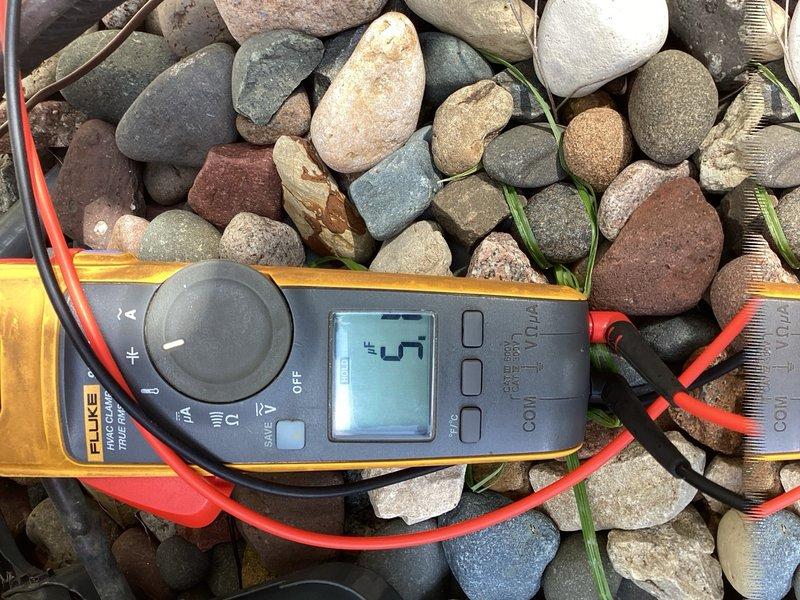 Responded to no cooling complaint on a 5-year-old residential air conditioning system. Upon arrival, confirmed indoor blower was operating but system was not producing cold air. Performed diagnostic inspection of outdoor condensing unit, testing compressor operation, contactor function, and capacitor performance with multimeter. Found failed run capacitor preventing compressor from starting. Replaced defective capacitor with proper replacement, verified all electrical connections, and cycled system through complete cooling operation. Confirmed proper refrigerant charge, measured temperature split at supply registers, and verified system returned to normal cooling operation.