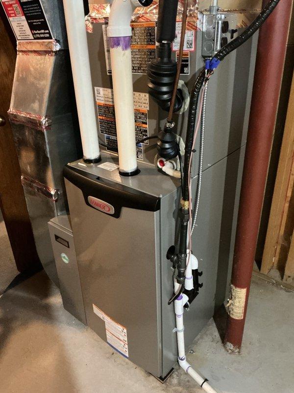 Completed annual AC tune-up on Lennox system installed last fall. Inspected air filter, verified evaporator drain line functioning properly, rinsed condenser coil, and confirmed all electrical connections within specifications. System started and tested, achieving proper 20-degree temperature split across evaporator coil, indicating optimal cooling performance.