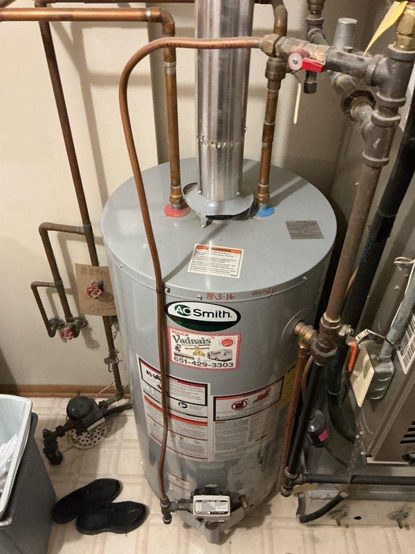 Responded to no hot water complaint on 10-year-old AO Smith tanked water heater. Upon diagnostic inspection, determined unit was not registering flame and unable to ignite burner assembly. After troubleshooting confirmed failure of ignition system components, replaced the water heater with new unit. Completed installation with proper copper piping connections, safety valves, and code-compliant configuration. Verified all connections secure, tested for proper operation, and confirmed hot water delivery restored to residence.