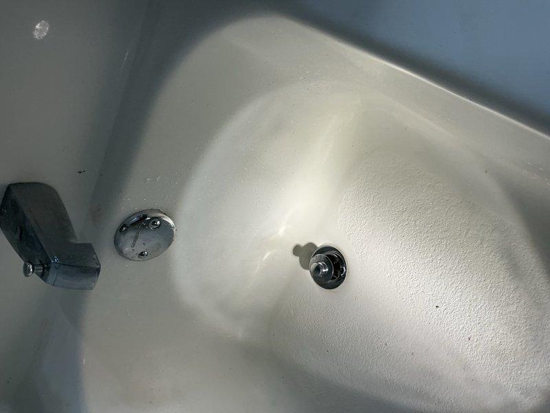 Responded to a water leak caused by a damaged cast iron bathtub drain assembly that was compromised during an attempted self-repair. Cut access hole in basement ceiling below the tub to reach the drain piping, removed the failed drain assembly, and installed a complete replacement tub drain with proper sealing. Tested the system for leaks and verified proper drainage function upon completion.