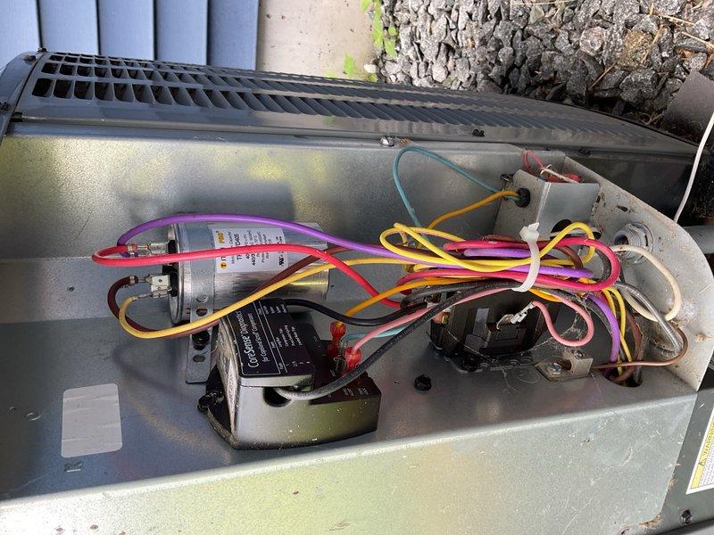 Responded to no cooling complaint with warm air blowing and minimal airflow. Upon arrival, diagnosed compressor clicking sound and identified failed capacitor as primary issue. Performed complete condenser coil cleaning, replaced defective capacitor, installed new air filter, and tested system operation to verify proper cooling restored.