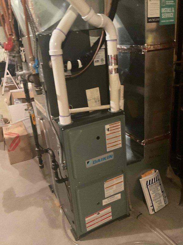 Responded to service call for reported water leaking from furnace unit. Upon arrival, thoroughly inspected Daikin furnace system, condensate drain lines, PVC piping, and surrounding area. Found evidence of previous water damage on nearby stored items, but no active leaking was present at time of inspection. All condensate drain lines, connections, and furnace components were examined and found to be dry with no visible moisture or active water discharge. Advised customer to monitor system and contact for service if leaking recurs.