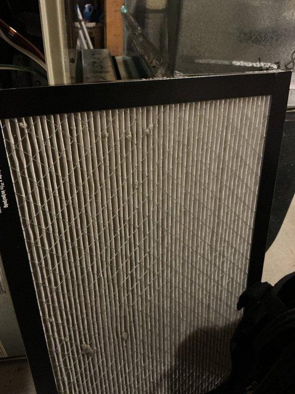 Responded to no cooling call on 24-year-old air conditioning system. Found failed fuses in outdoor disconnect, which were replaced to restore power to the condenser unit. Condenser fan motor required manual rotation to initiate operation, indicating failing motor bearings or capacitor issues. System returned to operational status as a temporary repair with no guarantee due to age and condition of equipment. Replaced dirty air filter during service. Scheduled system replacement estimate due to advanced age and deteriorating components that make further repairs inadvisable.
