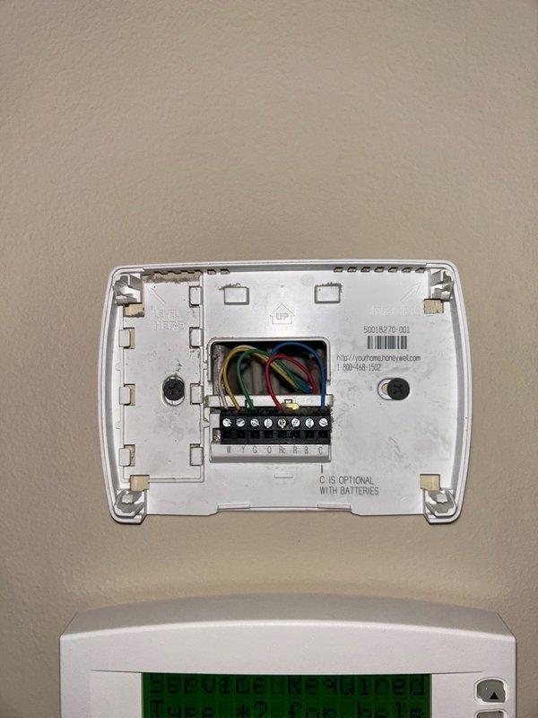 Responded to a no cool call on an older Carrier air conditioning system. Upon arrival, checked the furnace fault code which indicated a short in the low voltage circuit. Inspected the 3 amp fuse and confirmed a direct short was present. Traced the low voltage wiring through the outdoor unit and re-terminated connections between the indoor control board and outdoor low voltage terminals to isolate the fault. Tested the contactor coil and found it reading 0.5 ohms, confirming a failed and shorted coil. Replaced the outdoor contactor and re-terminated all low voltage wiring at both the indoor control board and outdoor unit connections. Rechecked system operation and confirmed the unit is now cooling normally with proper low voltage circuit function restored.