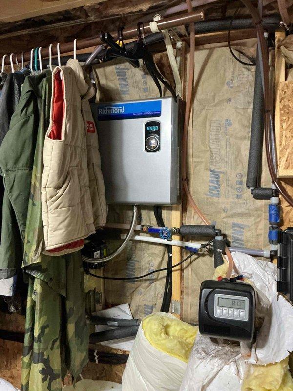 Completed comprehensive plumbing inspection of residential property including evaluation of tankless water heater installation, visible plumbing connections, and related utility systems. All findings documented with photographic evidence and detailed in inspection report for customer review.