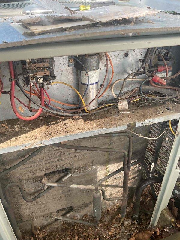 Completed annual preventive maintenance cooling visit on single AC system under maintenance agreement. Upon inspection, found rooftop unit with heavily soiled evaporator coils containing significant debris accumulation including leaves and organic material. Performed comprehensive tune-up including system evaluation, cleaning of components, and refrigerant level check. System was found to be low on refrigerant; recharged unit to proper operating levels. Verified thermostat operation and system functionality upon completion. All components tested and operating within normal parameters following service.