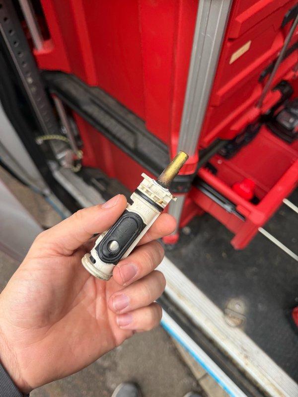 Responded to a slow water leak at the shower handle that was previously identified during annual inspection. Encountered a stripped shower handle screw which required use of a screw extractor for removal. Successfully replaced the failed shower cartridge and tightened the shower head to eliminate the leak.