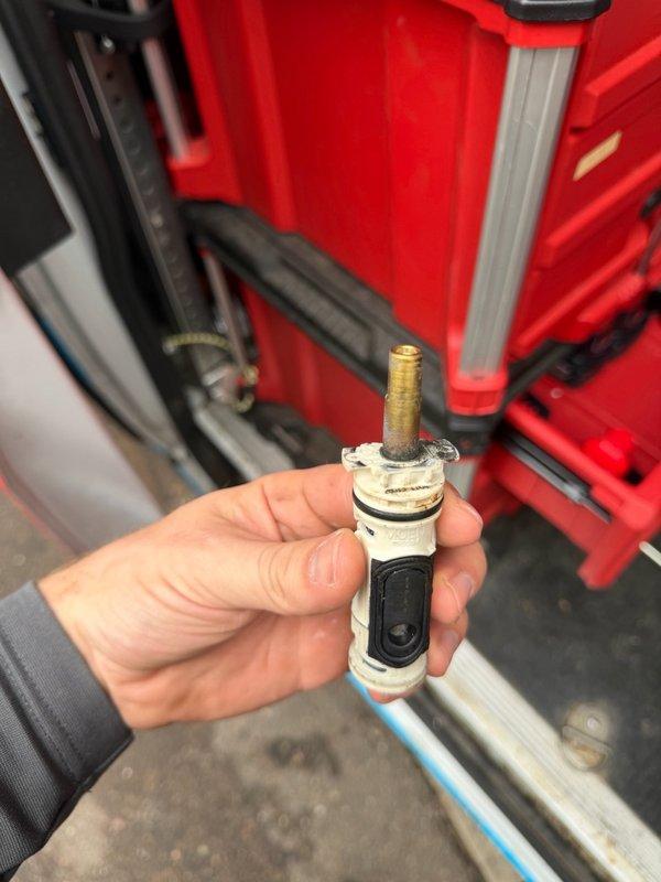 Responded to a slow water leak at the shower handle that was previously identified during annual inspection. Encountered a stripped shower handle screw which required use of a screw extractor for removal. Successfully replaced the failed shower cartridge and tightened the shower head to eliminate the leak.
