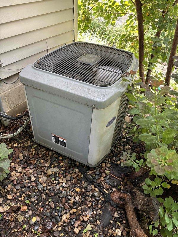 Completed comprehensive A/C maintenance on one R22 condensing unit as part of recurring maintenance agreement. Ambient temperature recorded at 75 degrees. Performed full system inspection including air filter, thermostat operation, temperature differential across evaporator coil, condenser unit components, evaporator and condenser coils, blower motor, outdoor fan motor, dual run capacitor, compressor operation, refrigerant pressures, and condensate drain line.

System inspection revealed low refrigerant charge based on pressure readings and operating characteristics. Unit is utilizing R22 refrigerant in an aging system showing signs of wear and environmental exposure. Interior electrical components and capacitor connections inspected and found operational, though housing showed accumulation of debris and weathering consistent with system age. Condenser coil accessible without ladder and inspected for proper airflow.

Recommended 20x25x4 air filter replacement, which homeowner will hand