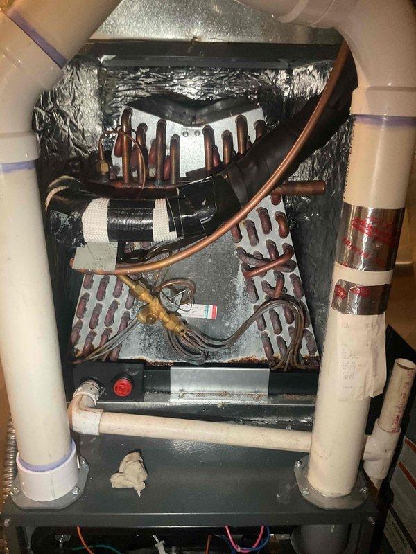 Responded to call for water leaking from Daikin furnace system that had been shut down by customer due to recurring water accumulation on floor. Diagnosed failed evaporator coil drain pan as source of leak. Removed and replaced defective drain pan, verified proper condensate drainage through white PVC drain lines, and confirmed all connections were secure with no further leakage detected upon system restart and testing.