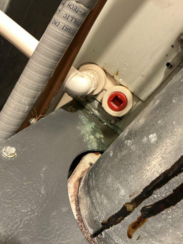 Responded to a no cooling call on a 22-year-old Nordyne air conditioning system. Upon arrival, found the unit running but discharging warm air. Conducted thorough system evaluation and discovered the evaporator A-coil completely frozen solid with ice accumulation. Further inspection revealed the refrigerant line set extending to the compressor was also frozen. System operates on R22 refrigerant, which is now obsolete and no longer manufactured. Used inspection camera to document internal coil condition and photographed affected components including frozen lines and valve assembly. Given the age of the equipment, extent of the freezing issue, and obsolete refrigerant type, recommended system replacement consultation. Coordinated scheduling for comfort advisor to provide replacement options and discuss modern, more efficient cooling solutions.