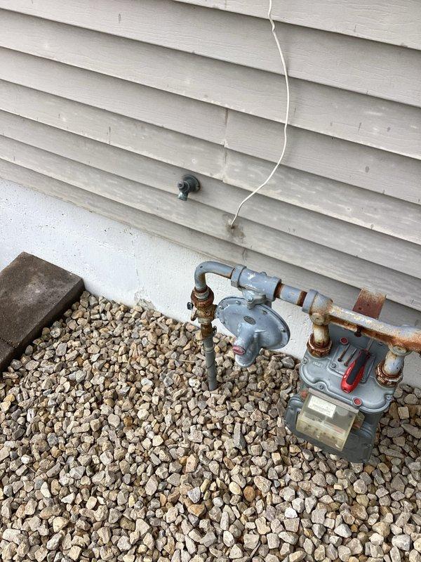 Responded to exterior spigot failure where the handle had snapped off after being over-tightened with channel locks due to persistent leaking. Upon inspection, found the existing spigot was damaged beyond repair. Shut off water supply and removed the broken spigot assembly. Confirmed adequate slack in the supply line to facilitate replacement. Installed a new threaded adapter to the existing line and mounted a new threaded outdoor spigot. Tested the installation for proper operation and verified no leaks at connections. Restored water service to the exterior fixture.