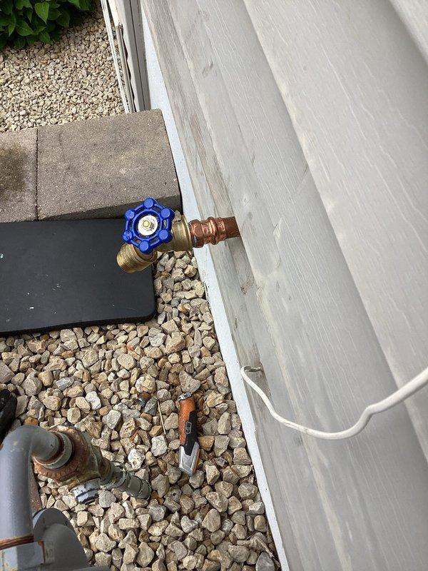 Responded to exterior spigot failure where the handle had snapped off after being over-tightened with channel locks due to persistent leaking. Upon inspection, found the existing spigot was damaged beyond repair. Shut off water supply and removed the broken spigot assembly. Confirmed adequate slack in the supply line to facilitate replacement. Installed a new threaded adapter to the existing line and mounted a new threaded outdoor spigot. Tested the installation for proper operation and verified no leaks at connections. Restored water service to the exterior fixture.