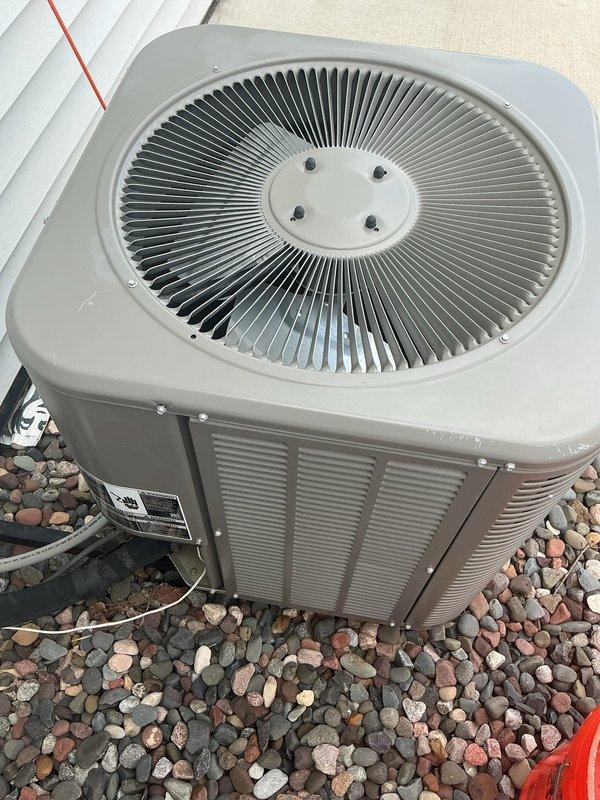 Responded to no cooling call on 2021 Lennox unit still under warranty. Upon arrival, confirmed compressor was running but condenser fan motor had failed and was not spinning. Replaced defective condenser fan motor with new unit, verified proper operation of fan and airflow, and tested system performance to ensure unit was cooling properly.