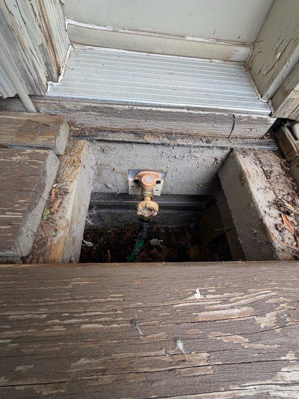 Responded to service call for leaking exterior hose bibs at property. Upon inspection, identified failed vacuum breaker on rear hose bib causing leak from top of fixture and loose packing nut on front hose bib. Replaced defective vacuum breaker assembly on rear unit and tightened packing nut on front fixture to eliminate leaks. Repositioned hose bib forward approximately two inches to improve accessibility for future maintenance requirements. Both fixtures tested and confirmed operational with no active leaks upon completion.