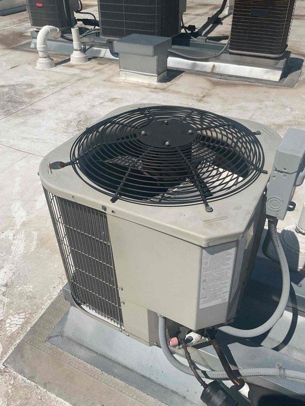 Completed annual cooling maintenance on rooftop packaged unit as part of preventative maintenance agreement. Performed comprehensive tune-up including system diagnostics, refrigerant pressure and temperature verification using digital manifold gauges, drain line cleaning, and operational testing. Unit operating within normal parameters with no issues found; previously reported machine gun sound at startup not present during service visit.