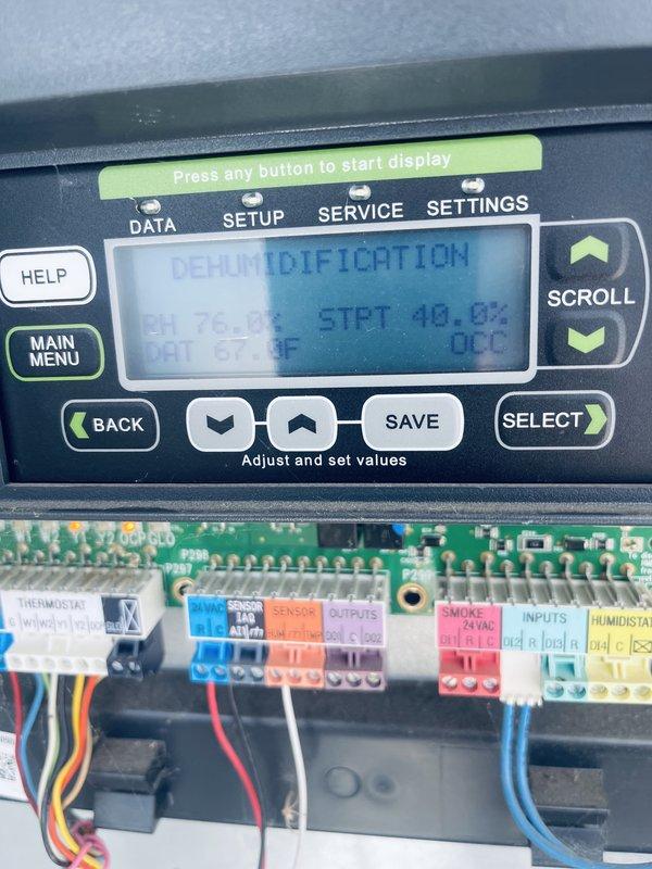 Responded to no cooling complaint on commercial rooftop unit. Found unit locked out on fault code 42 due to tripped three-phase motor relay, likely caused by power outage earlier in the day. Reset motor protection relay and monitored system operation for 35 minutes to verify proper functionality. Unit returned to normal cooling operation. Noted dirty filters requiring replacement by facility management. Control panel displayed dehumidification mode with humidity reading at 48.8%. All electrical connections inspected and secured during troubleshooting.
