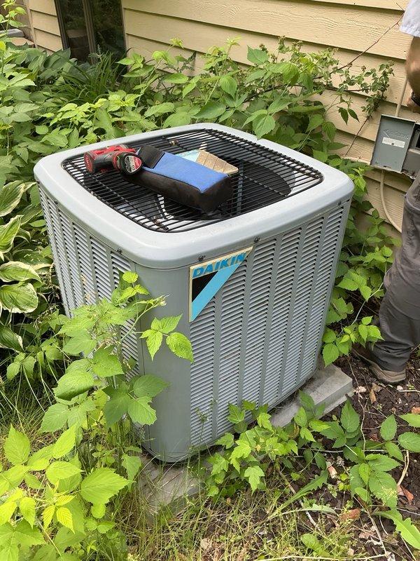 Responded to no cooling complaint on 8-year-old Daikin system. Upon inspection, outdoor unit fan was operational but compressor was not running. Diagnosed failed dual run capacitor with dead compressor terminal. Verified condenser coils were clean and all other components functioning properly. Replaced defective capacitor and restored system to full operation with verified 20-degree temperature split across evaporator coil.
