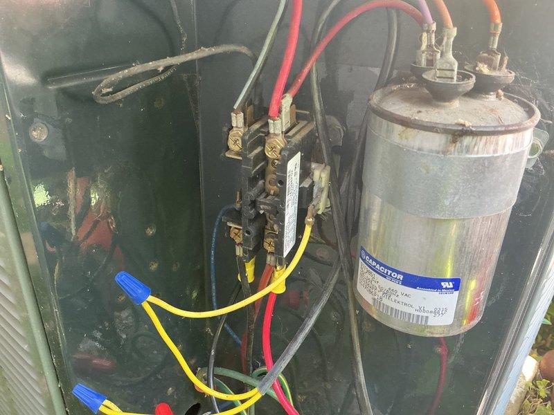 Responded to no-cool complaint on a 1993 residential air conditioning system. Upon inspection, found failed capacitor preventing compressor operation. Replaced defective capacitor and performed full system evaluation. Testing revealed compressor drawing high amperage and system running low on R22 refrigerant. Due to age of equipment, obsolete refrigerant type, and compressor condition indicating potential imminent failure, advised customer this repair is temporary and recommended full system replacement. Scheduled replacement estimate for following day.