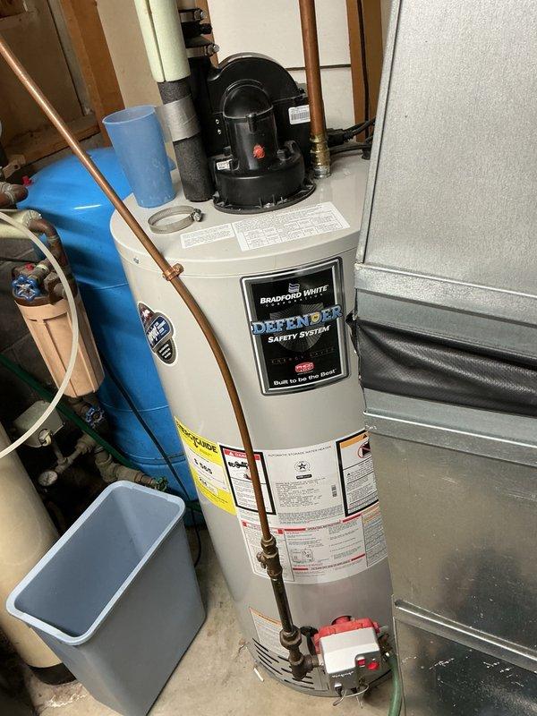 Responded to furnace service call following home inspection that identified rust accumulation near the condensation pan area. Upon inspection, discovered significant rust below the inducer motor and traced the source to an improperly installed exhaust clamp that was positioned upside down and insufficiently tightened. This caused condensate to leak from the exhaust pipe onto the furnace base, resulting in corrosion. Removed the defective clamp, verified no additional leak points in the exhaust system, and reinstalled the clamp in the correct orientation with proper tightening to manufacturer specifications. Performed preventative maintenance including burner cleaning and complete operational testing of all furnace components. Confirmed unit is now operating within normal parameters with no condensate leakage and proper exhaust venting.