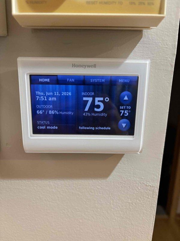 Completed comprehensive A/C maintenance on Bryant system with 410A refrigerant under ambient conditions of 67°F outdoor temperature. Performed full system inspection including air filter, Honeywell thermostat operation, temperature differential measurement, condenser unit, evaporator and condenser coils, blower motor, capacitor testing, compressor function, refrigerant charge level, and condensate drain line. Found capacitor reading slightly out of manufacturer specifications and recommended replacement with 45+5 MFD dual capacitor, which was declined by homeowner. System appears to be potentially low on refrigerant by less than one pound; recommended monitoring cooling performance and operational efficiency. All other components inspected and found to be functioning within normal parameters. System currently operating satisfactorily with no immediate service concerns.