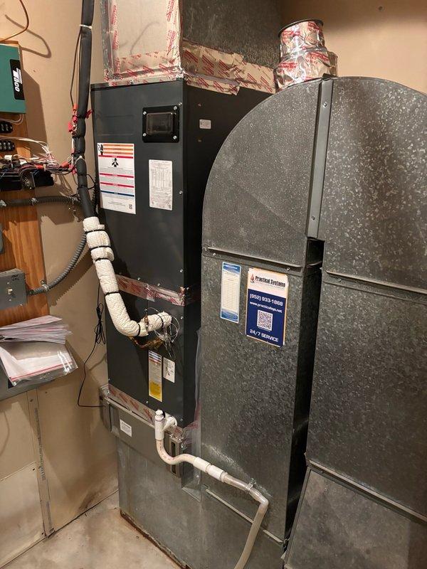 Responded to service call for inadequate hot water supply, with customer reporting only 3 minutes of warm water before turning cold during showers and dishwashing. Issue began following previous service visit where technician stood on top of water heater to access corner spigot, raising concerns about potential damage to internal components or thermostat from weight and vibration during pipe cutting work.

Inspected indirect water heater system in mechanical room and performed diagnostic testing by running multiple fixtures throughout the residence. Confirmed intermittent hot water delivery with water heating briefly before returning to cold temperature. Conducted thorough inspection of plumbing rough-in to identify potential crossover points between hot and cold water lines, focusing on mixing valves and tub/shower connections as probable failure locations.

Tested infrequently used basement shower fixtures and identified significant air pressure imbalance in shower located across fro