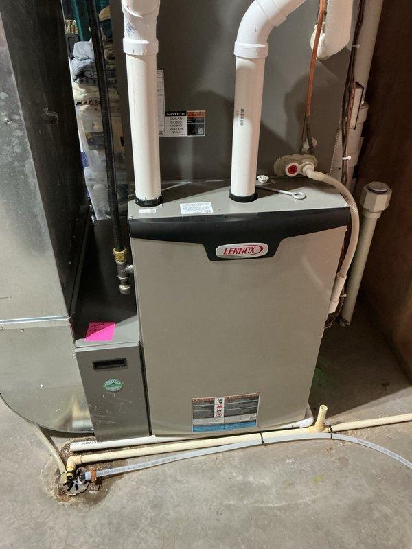 Completed comprehensive cooling season maintenance on 4-year-old Lennox HVAC system. Performed full AC tune-up including removal of condenser panels and thorough rinsing of condenser coil to ensure optimal heat transfer. Replaced air filter and humidifier pad to prepare system for upcoming winter season. Verified evaporator drain line was flowing properly with no blockages. Started system and confirmed all components operating within normal parameters with no issues detected.