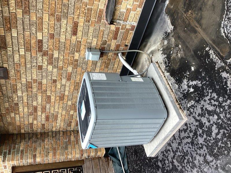 Responded to no-cooling callback following recent evaporator coil replacement. Performed comprehensive system diagnostic including condenser inspection, refrigerant level verification, thermostat and wiring checks, and attic air handler examination. Found wet switch tripped with no water present in drain pan or evidence of overflow from evaporator coil pan. Reset wet switch and restored system to normal operation. Recommended wet switch replacement to prevent future nuisance trips. System cooling properly upon departure.