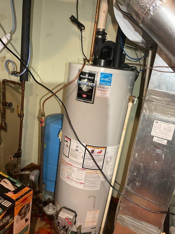 Responded to service call for 2019 Lennox air conditioning system with water leakage issue. Upon arrival, unit was off and water was present on floor. Removed access panel to inspect evaporator coil and drain system. Performed diagnostic water test on drain pan which revealed complete blockage preventing proper drainage. Located obstruction in barb fitting of condensate drain line. Cleared blockage from barb fitting using compressed air and thoroughly flushed drain pan to remove accumulated debris. Restored unit to operation and monitored condensate drainage system to verify proper flow and function. System cooling normally with condensate draining as designed.