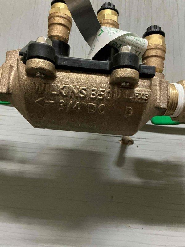 Replaced failed RPZ backflow preventer with new Watkins RPZ assembly to protect potable water supply from contamination in commercial mechanical room. Removed deteriorated existing backflow device and installed new unit with proper brass fittings, test cocks, and pressure connections per code requirements.