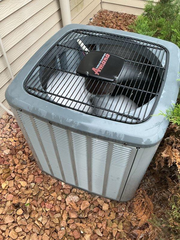 Responded to no cooling call on 13-year-old residential air conditioning system with non-operational condenser unit. Diagnosed failed dual run capacitor preventing compressor and condenser fan operation. Replaced defective dual capacitor with proper replacement, restored system to normal cooling operation, and verified amperage readings within manufacturer specifications.
