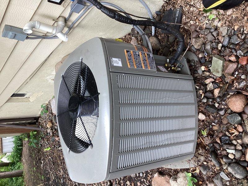 Responded to callback for AC system less than one year old with inadequate cooling performance. Upon arrival, performed comprehensive system evaluation including outdoor condenser unit inspection, capacitor and contactor testing, and compressor operation verification. Cleaned condenser coil of debris and cottonwood accumulation. Inspected indoor evaporator coil, drain system, furnace control board, and A2L safety board—all components found in acceptable condition.

Diagnosed primary issue: blower motor failing to ramp up to high-speed cooling mode during system operation, remaining in default low-speed fan-only setting resulting in insufficient airflow and reduced cooling capacity. Root cause identified as improper thermostat wiring configuration to furnace control board. Y2 terminal was not energizing to trigger two-stage cooling operation and high-speed blower activation.

Corrected wiring by jumping Y1 and Y2 terminals at furnace to enable proper two-stage cooling communication. Ver