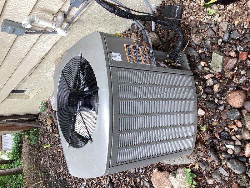 Responded to callback for AC system less than one year old with inadequate cooling performance. Upon arrival, performed comprehensive system evaluation including outdoor condenser unit inspection, capacitor and contactor testing, and compressor operation verification. Cleaned condenser coil of debris and cottonwood accumulation. Inspected indoor evaporator coil, drain system, furnace control board, and A2L safety board—all components found in acceptable condition.

Diagnosed primary issue: blower motor failing to ramp up to high-speed cooling mode during system operation, remaining in default low-speed fan-only setting resulting in insufficient airflow and reduced cooling capacity. Root cause identified as improper thermostat wiring configuration to furnace control board. Y2 terminal was not energizing to trigger two-stage cooling operation and high-speed blower activation.

Corrected wiring by jumping Y1 and Y2 terminals at furnace to enable proper two-stage cooling communication. Ver