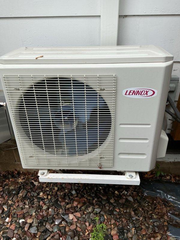 Completed Family Rewards cooling maintenance visit on Lennox ductless mini-split system. Performed comprehensive tune-up including cleaning indoor unit air filters and inspecting blower wheel assembly, which were found to be in clean condition. Inspected outdoor condenser unit for rodent intrusion and debris—no issues detected. Rinsed condenser coil to ensure optimal heat transfer efficiency. Started system and verified proper operation with 20-degree temperature differential across the evaporator coil, confirming unit is performing within manufacturer specifications. All components operating normally with no deficiencies noted.