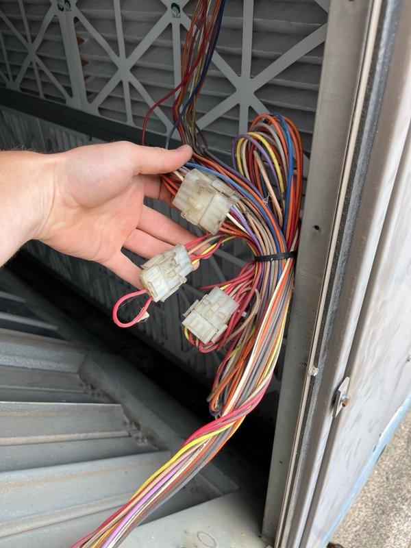 Responded to commercial RTU service call for limit switch replacement and filter maintenance. Upon arrival, procured and installed five new air filters and replacement limit switch. After installation, unit continued displaying error code 11, indicating economizer engaged for free cooling mode while cutting power to compressors. Condenser fan operation remained problematic with new limit switch installed.

Through diagnostic troubleshooting, determined incorrect limit switch had been supplied—unit required normally closed switch rather than normally open configuration. Reinstalled original limit switch and implemented temporary repair by jumping second condenser fan motor from existing limit to ensure proper operation during cooling calls. 

Observed ongoing conflict between economizer and cooling system operation. During cooling demand, compressor would engage briefly before system switched to economizer free cooling mode, creating inefficient cycling pattern. Documented findings and 