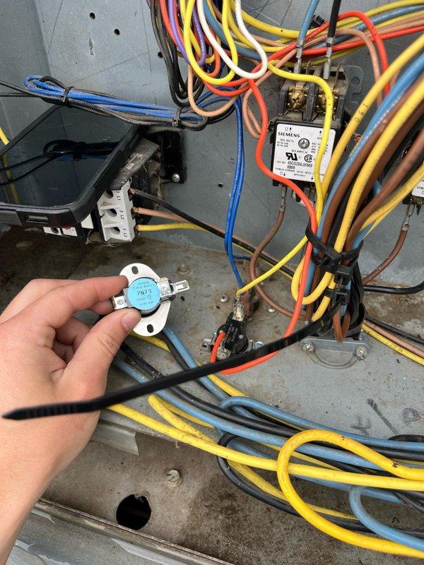 Responded to commercial RTU service call for limit switch replacement and filter maintenance. Upon arrival, procured and installed five new air filters and replacement limit switch. After installation, unit continued displaying error code 11, indicating economizer engaged for free cooling mode while cutting power to compressors. Condenser fan operation remained problematic with new limit switch installed.

Through diagnostic troubleshooting, determined incorrect limit switch had been supplied—unit required normally closed switch rather than normally open configuration. Reinstalled original limit switch and implemented temporary repair by jumping second condenser fan motor from existing limit to ensure proper operation during cooling calls. 

Observed ongoing conflict between economizer and cooling system operation. During cooling demand, compressor would engage briefly before system switched to economizer free cooling mode, creating inefficient cycling pattern. Documented findings and 