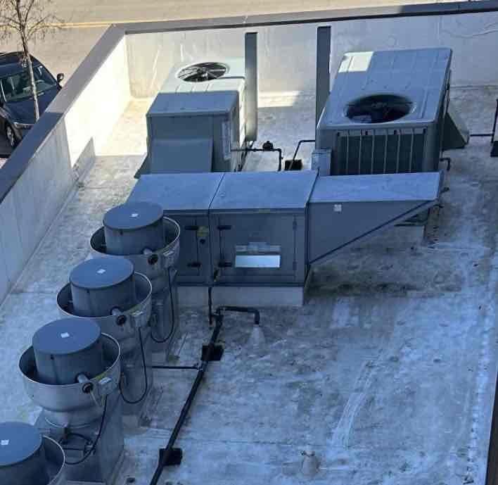 Responded to no cooling call on kitchen rooftop unit. Upon arrival, found unit non-operational with smoke detector tripped and unable to reset, indicating potential electrical fault or component failure. Inspected rooftop equipment and accessed control board to assess system condition. Documented equipment location and control board configuration with photos for diagnostic reference. Due to safety lockout from smoke detector activation, unit requires further troubleshooting and repair estimate before restoration of service can proceed.