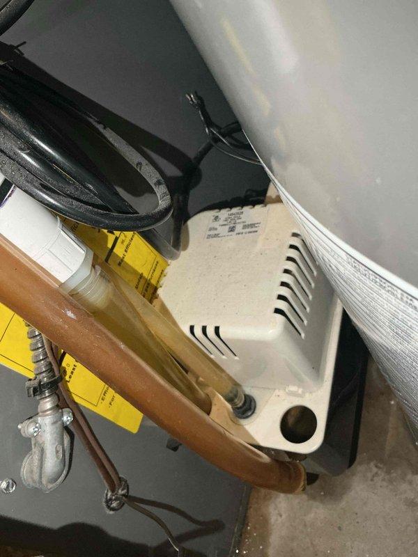 # HVAC Service Completed

Responded to a no cooling call on a 10+ year old system where water leakage was initially reported near the furnace. Upon arrival, confirmed active water leak originating from a failed condensate pump in the mechanical area. System had been shut down with furnace fan left in "on" position to prevent further water damage.

Diagnosed the condensate pump as the source of the leak, which had been allowing water to overflow from the drain pan onto the surrounding floor. The failed pump was unable to evacuate condensate water produced during normal air conditioning operation, causing water accumulation and spillage in the utility area.

Removed the defective condensate pump and installed a new replacement unit. Reconnected all condensate drain lines and electrical connections to the new pump. Verified proper pump operation and confirmed adequate drainage of condensate water from the system. Tested the air conditioning system through a complete cooling cycle to ensur