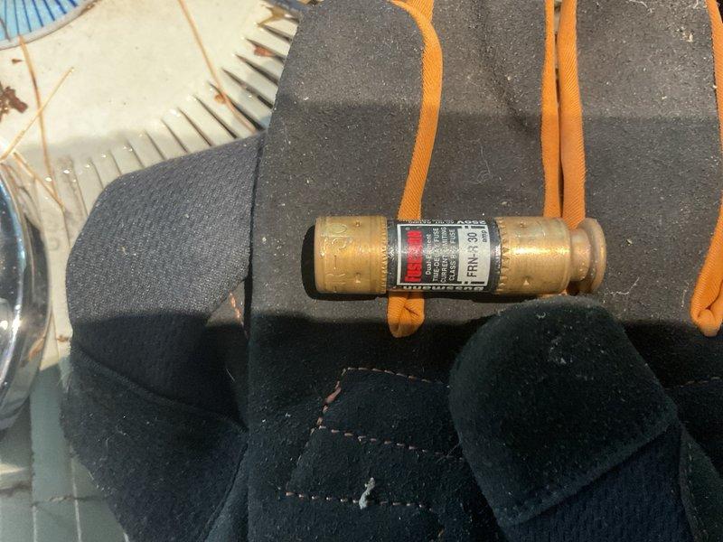 Responded to no-cool condition on 26-year-old Heil R-22 residential air conditioning system. Upon arrival, confirmed 240V line voltage present at outdoor unit but condenser was not operating. Diagnosed tripped fuse at outdoor disconnect as cause of system failure. Performed electrical testing on compressor windings with results indicating proper operation. Verified refrigerant charge within acceptable parameters. Replaced failed fuse and restored power to condenser unit. System started and ran normally with proper supply voltage confirmed. No hard short detected during diagnostic testing. Advised homeowner that due to advanced age of equipment, intermittent electrical failures remain possible and system should be monitored closely for recurring issues related to aging components.