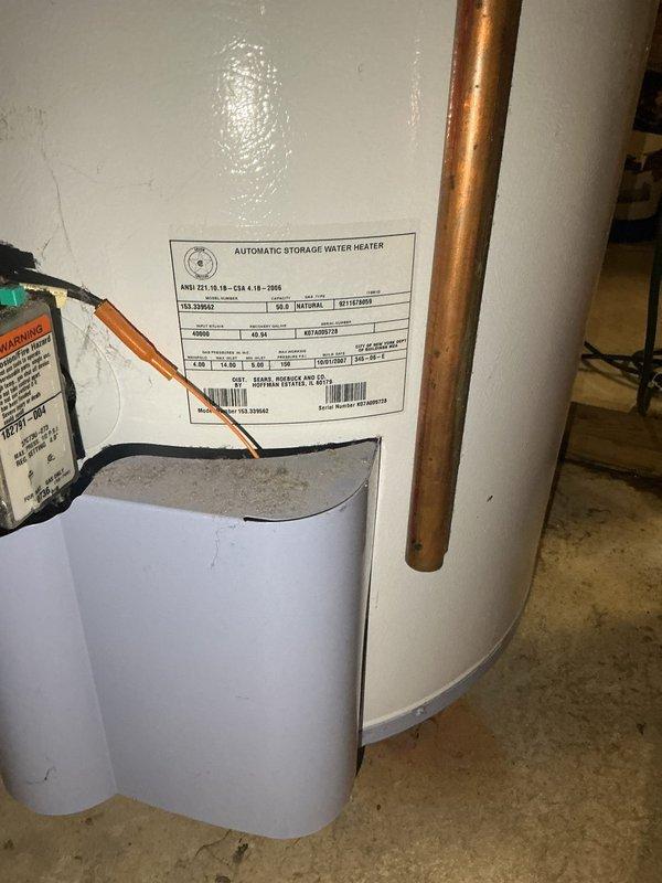 Responded to emergency call for leaking water softener system in basement utility area. Upon arrival, found water softener experiencing severe leakage from multiple points on the control head assembly, with active water discharge requiring immediate attention. Assessed unit condition and determined repair was not viable due to extent of deterioration and corrosion on copper piping connections. Bypassed the water softener system to restore water flow to the residence and prevent further water damage. Completely removed the failed water softener unit from the plumbing system. Documented existing plumbing infrastructure including copper supply lines, PVC drainage, and water heater connections. Provided detailed estimate for installation of customer-supplied replacement water softener unit.