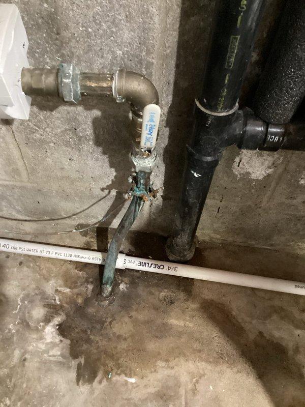 Responded to a water leak in the basement at the main water line connection. Upon inspection, identified a slow leak at the compression nut fitting located before the main shutoff valve. The existing nut had failed to maintain a proper seal, causing water seepage at the connection point. Replaced the defective compression nut with a new fitting to restore a watertight seal. Verified the Apollo ball valve assembly and surrounding copper piping for additional issues. Tested the repair under full water pressure to confirm the leak was eliminated and all connections were secure.
