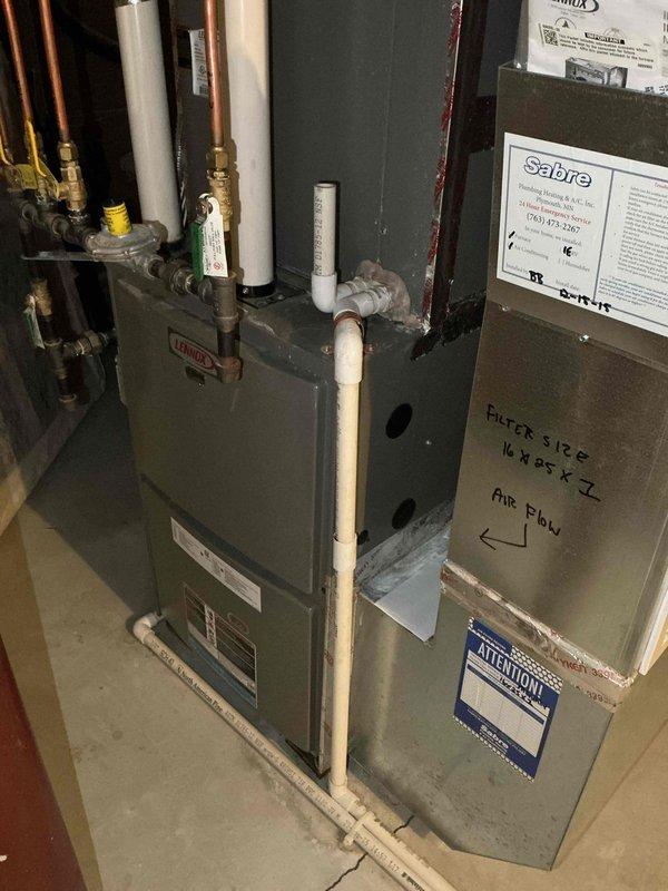 Completed comprehensive AC tune-up on 14-year-old residential cooling system. All components tested within manufacturer specifications, refrigerant charge verified at proper levels, and system operational performance confirmed. Outdoor condenser coils found heavily soiled requiring full disassembly for thorough cleaning to restore optimal heat transfer efficiency and extend equipment lifespan. Identified air-restrictive furnace filter (high MERV rating) limiting airflow; recommended switching to MERV 7-8 rated filter with monthly replacement schedule to improve system performance and reduce strain on blower motor.