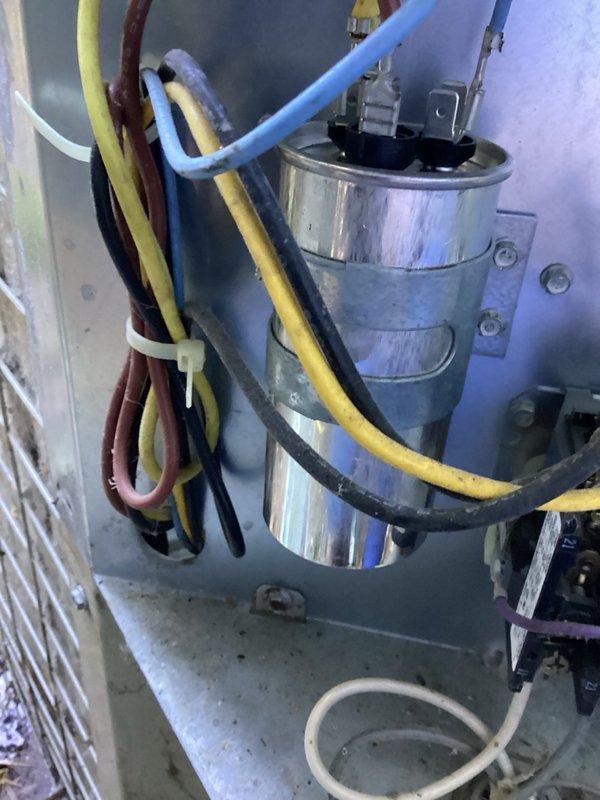 Completed annual spring cooling tune-up on older AC system and air exchanger unit. AC system is currently operational but found to be low on refrigerant charge; recommended planning for system replacement in near future. Air exchanger unit exhibiting multiple critical issues including motor slow-start condition with excessive noise and heat buildup, deteriorating filters that are difficult to clean, missing condensate drain line causing water discharge directly onto floor, and improper exhaust configuration venting stale air back into living space. Verified furnace filter recently changed and humidifier properly shut down for cooling season. Strongly recommended priority replacement of air exchanger due to compromised performance and improper drainage/ventilation configuration.