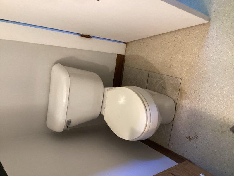 Responded to water leak originating from bathroom main line with visible ceiling damage. Upon inspection, identified failed cast iron closet flange as source of leak. Installed cast iron closet repair flange and properly reset toilet to restore functionality and eliminate water intrusion. Documentation photos captured pre-repair conditions and completed flange installation.