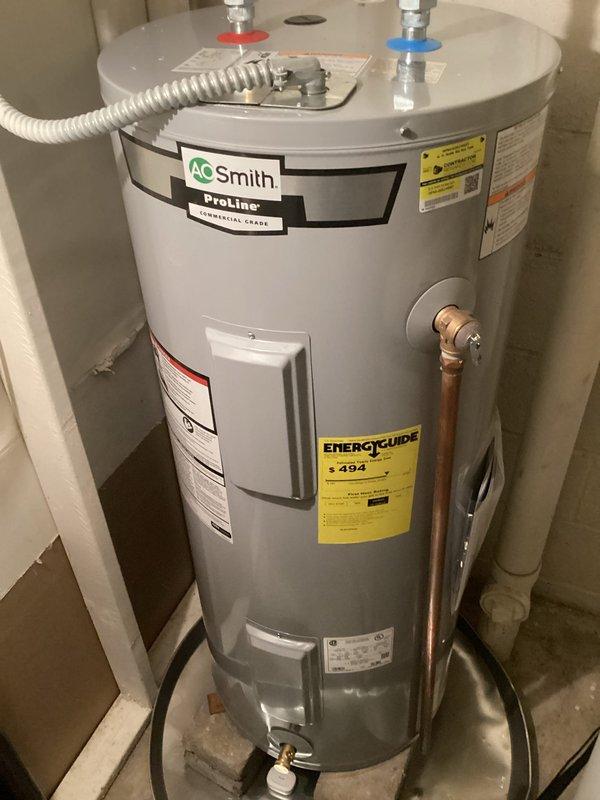 Completed scheduled air conditioning maintenance and tune-up on residential HVAC system. Documented equipment make, model, and serial number information with clear photographs as requested. System operational with no deficiencies noted at time of service.