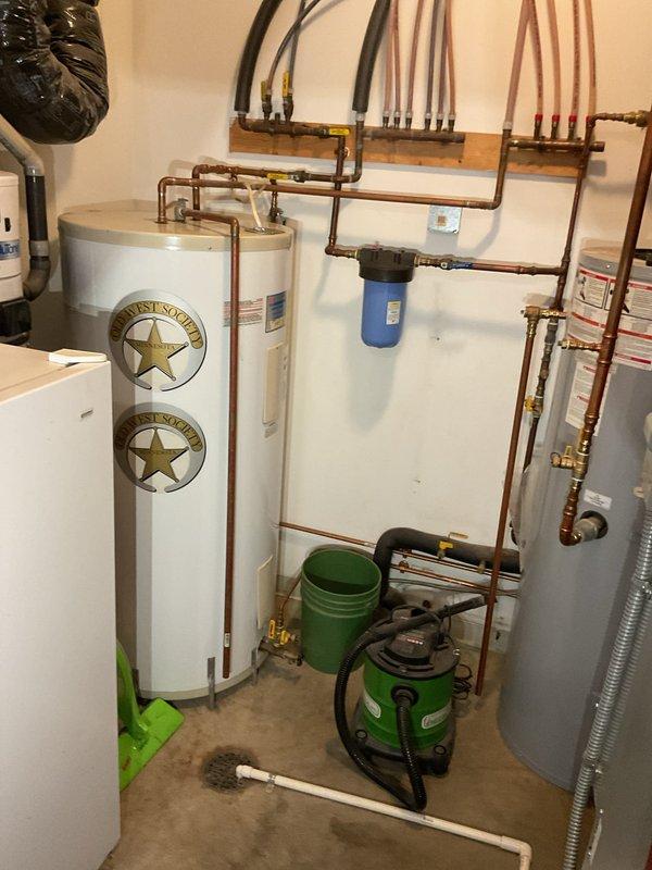 Met with prospective homeowner and realtor at property being sold to provide consultation on geothermal heating system. Explained system operation, components, and functionality of the geo unit in response to questions from potential buyer. Provided overview of mechanical room equipment including water heaters, copper piping distribution manifolds, and associated plumbing infrastructure to familiarize new owner with the system layout and basic operation.