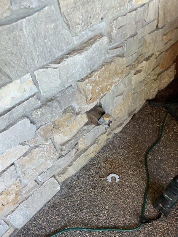 Responded to service call for leaking outdoor hose bib with non-replaceable seals. Upon inspection, determined the existing hose spigot was beyond repair and required full replacement. Accessed the plumbing connection by cutting an opening in the interior wall behind the exterior spigot location. Removed the failed hose bib assembly and installed a new non-frost-free outdoor spigot with proper connections. Tested the new installation for leaks and verified proper water flow and shut-off operation. Advised property owner of the importance of draining the spigot completely before winter months to prevent freeze damage, as the non-frost-free design requires seasonal maintenance. All components functioning correctly upon completion.