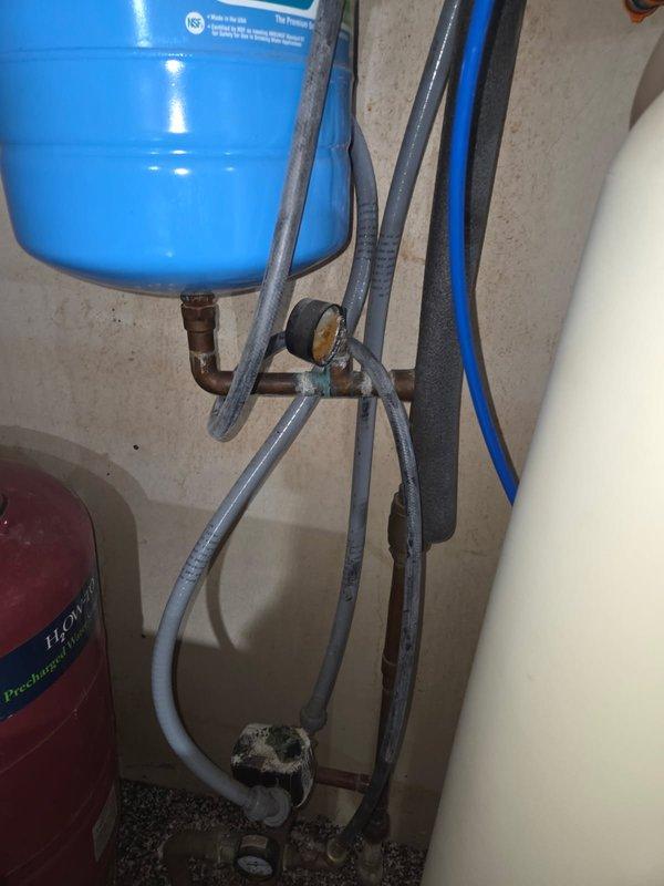 Responded to multiple copper pipe leaks in residential plumbing system, including critical leak near pressure tank dripping onto electrical components. Conducted comprehensive inspection of all affected areas and documented conditions with photographs. Reviewed all leak locations with homeowner and assessed system condition, noting exposed copper piping in ceiling joists and pressure tank connections requiring attention. Coordinated estimate for complete repipe and new pressure tank tee with accessories to address systemic issues and prevent future failures.